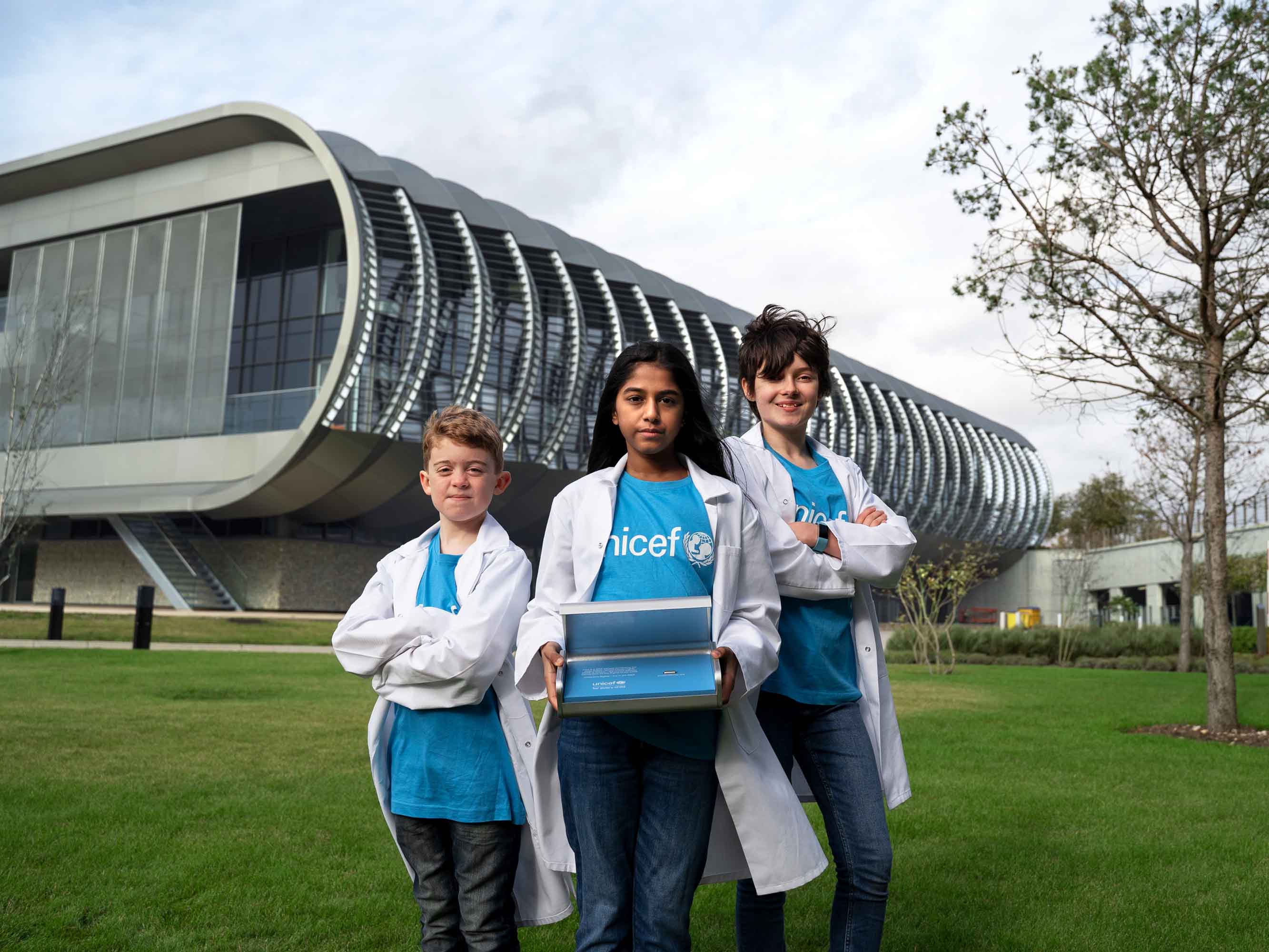 UNICEF children in front of EMBL-EBI South Building